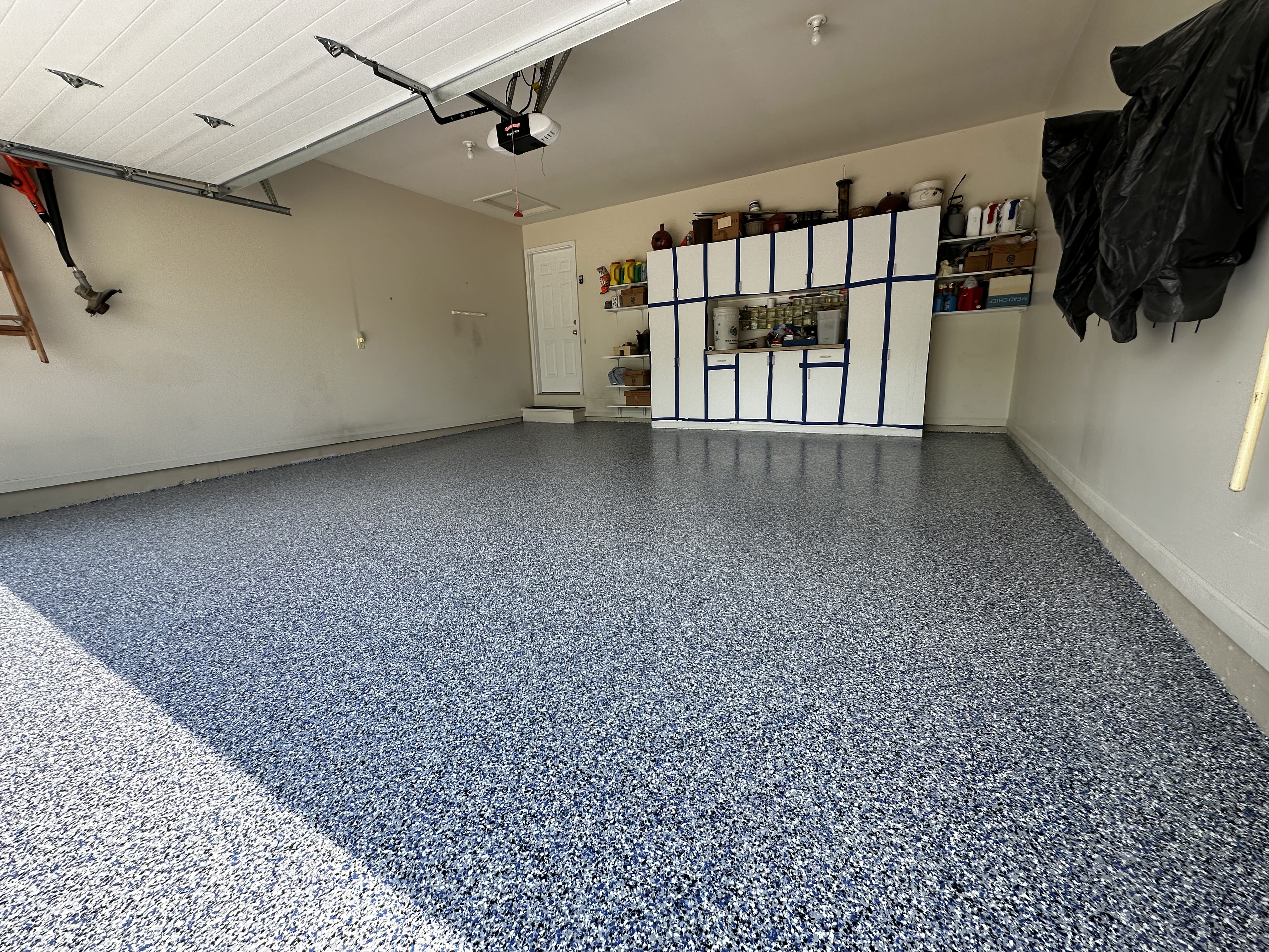 Epoxy and polyaspartic garage floor coatings